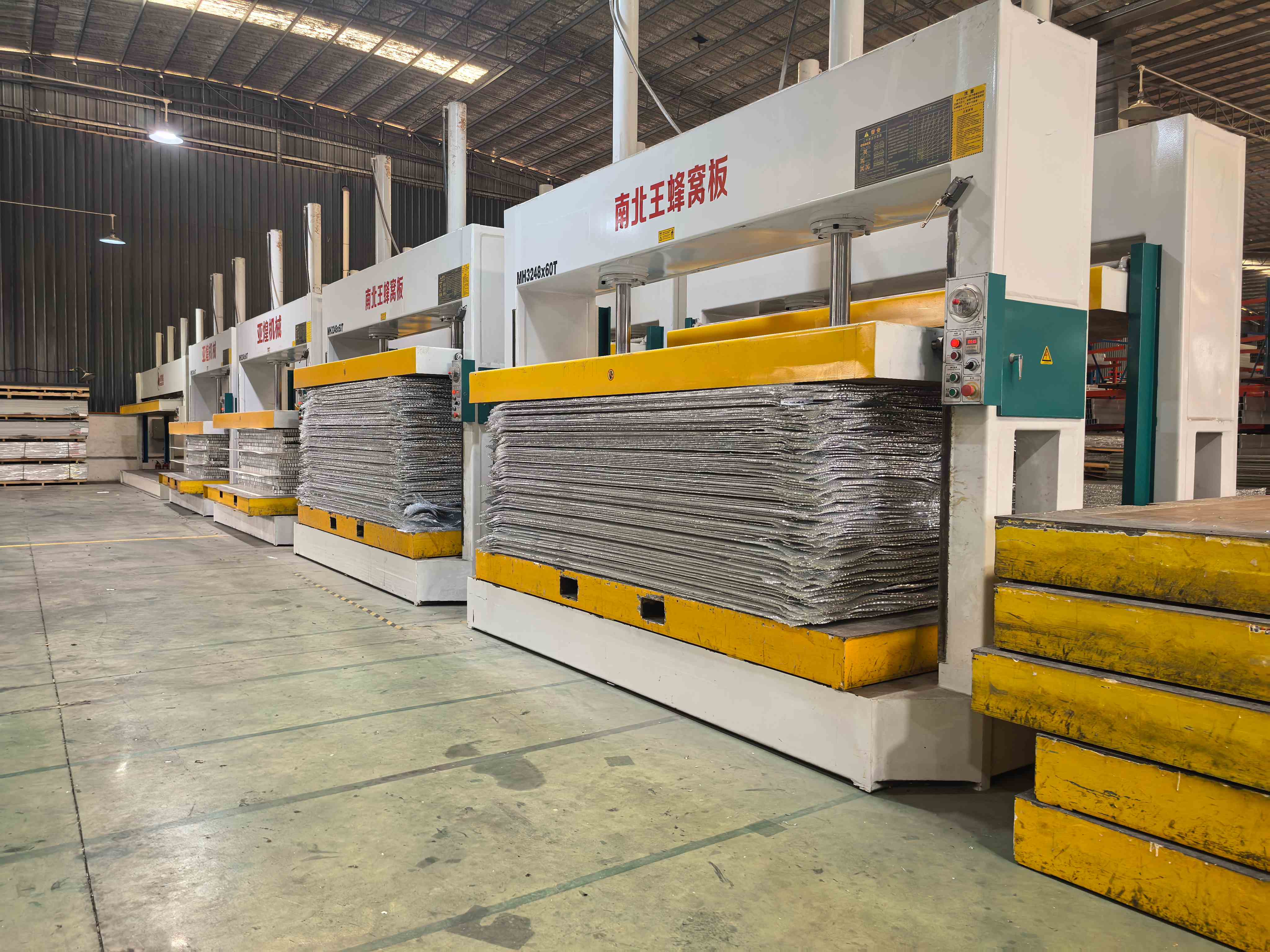Panel lamination presses at the production facility